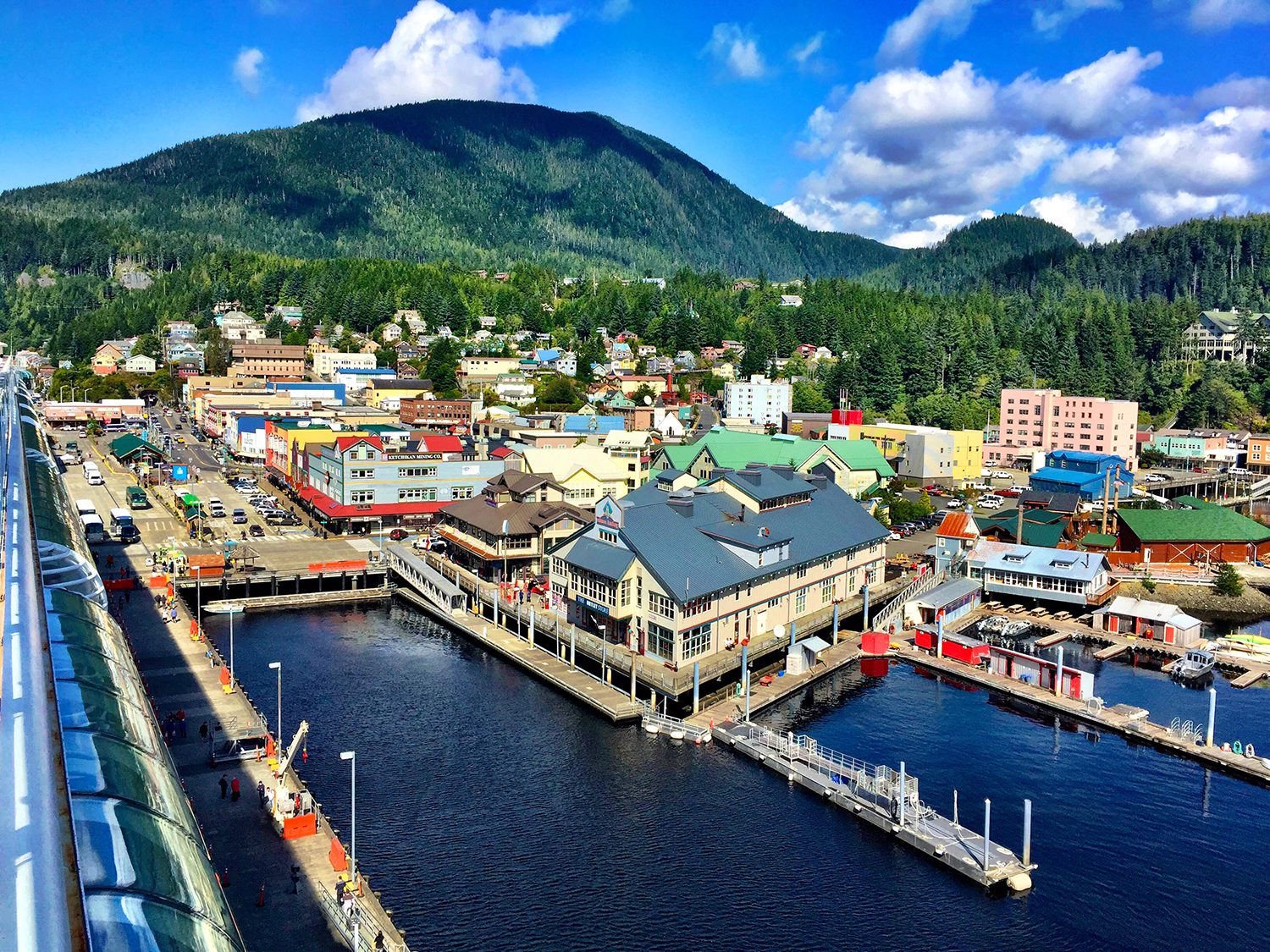 High Angle View Of Townscape By River Against Sky