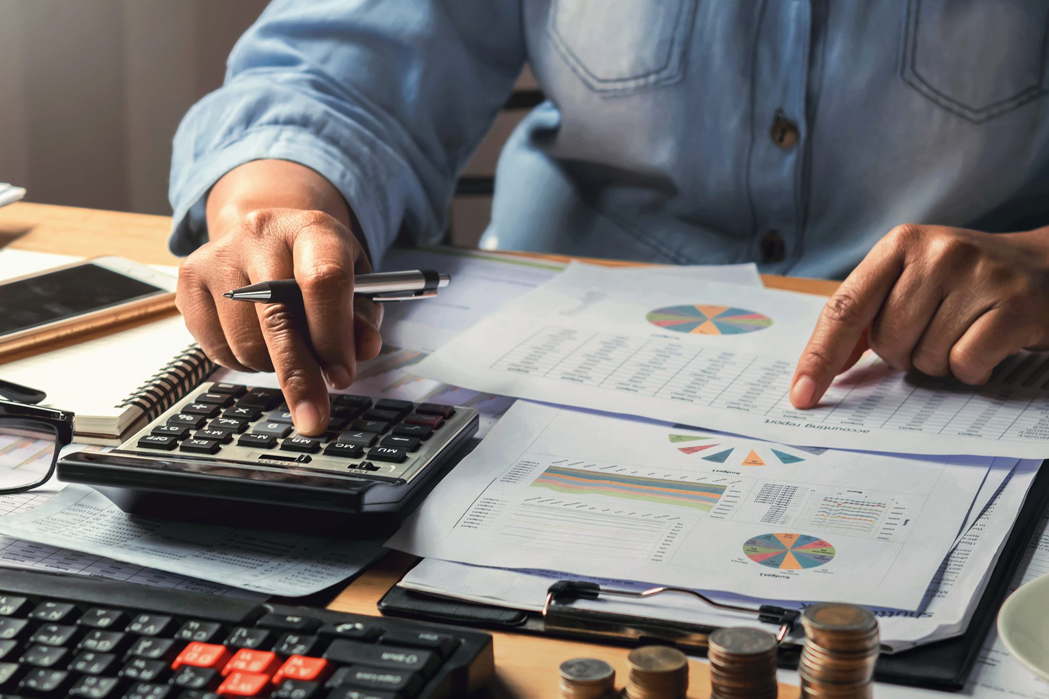 accounting concept. businesswoman working using calculator with