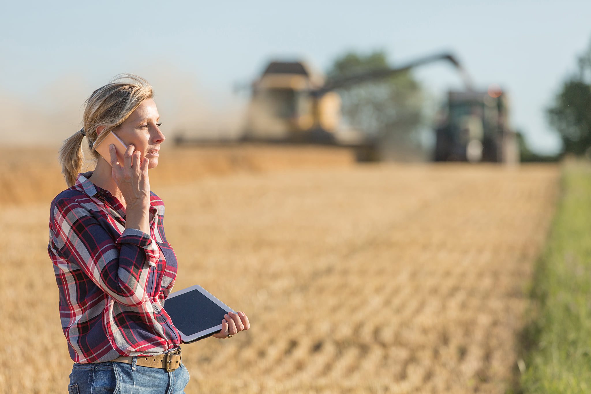 Woman Uses Wireless Service on a Rural Farm