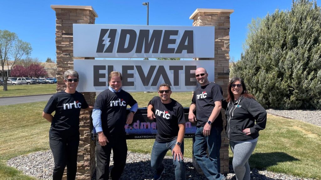 NRTC members at DMEA/Elevate Internet Pose with their NRTC gear.